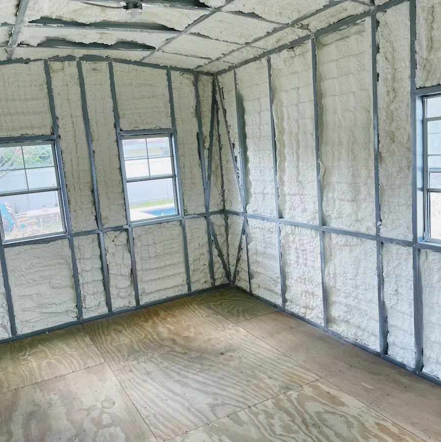 Closed-cell spray foam insulation applied to wall cavities in a residential project in Wallington